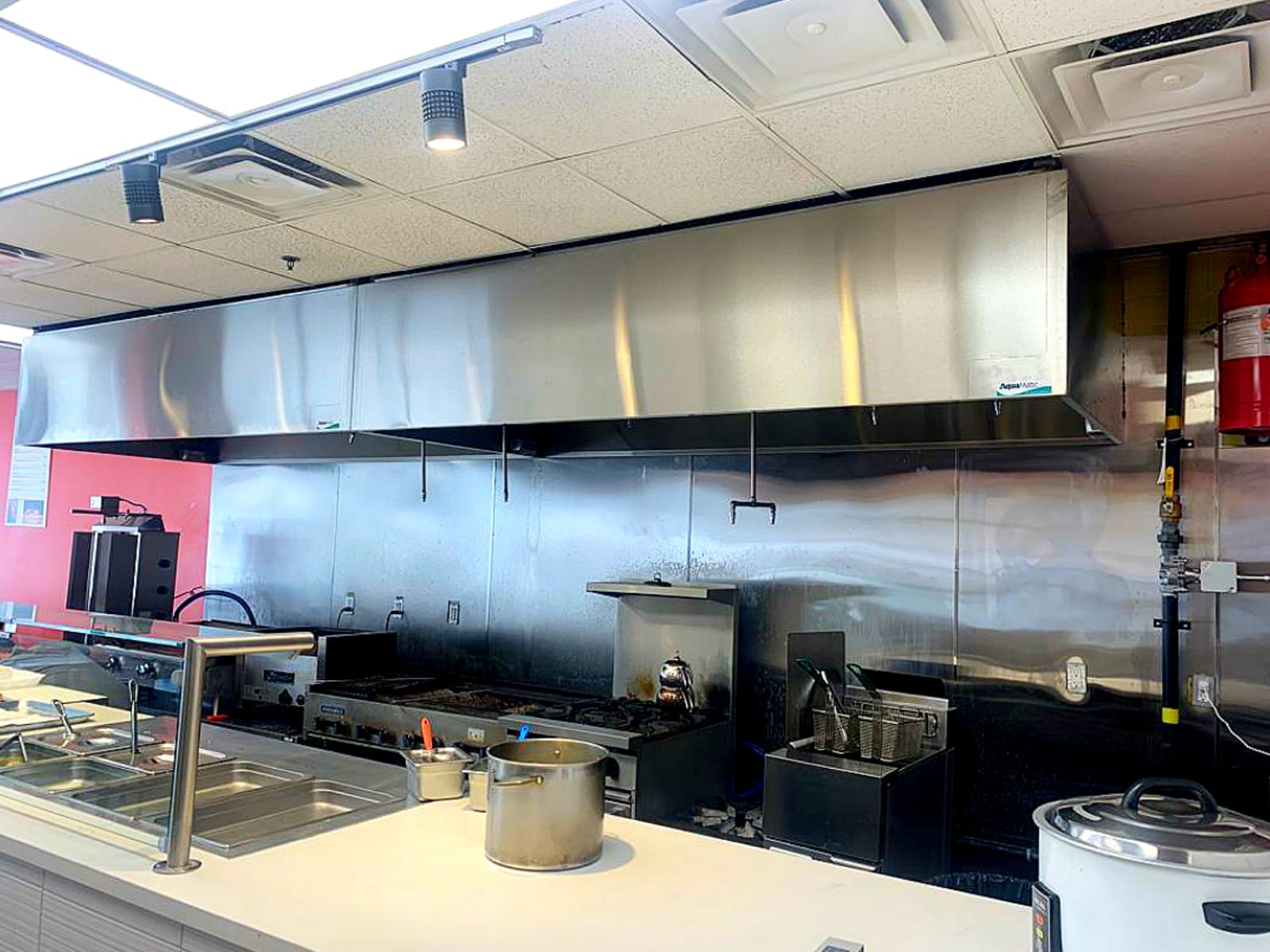 Big kitchen with long hood