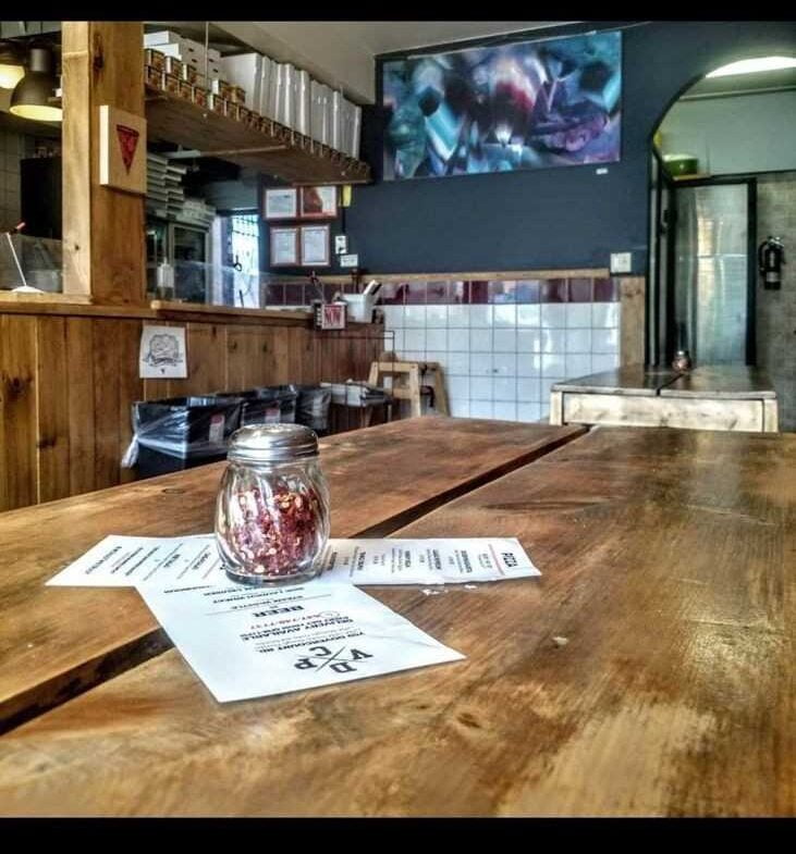 Table with chili fliks jar