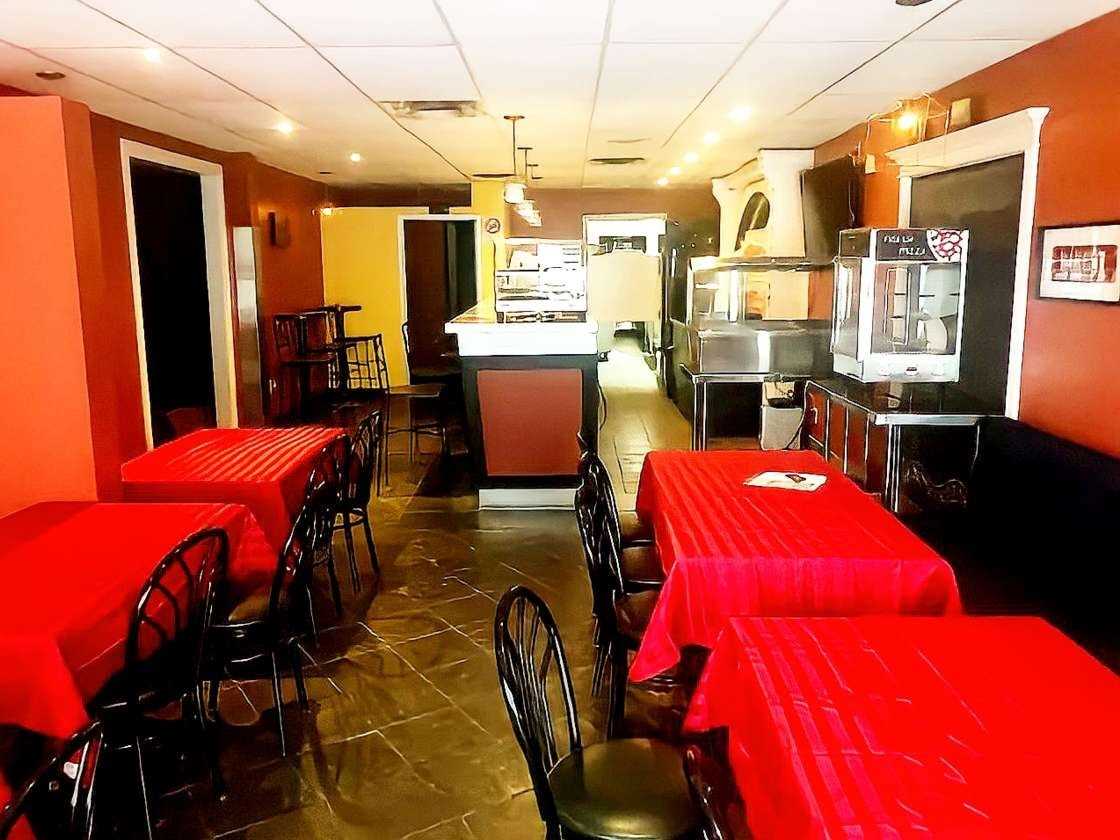 Black chair with red sheeted table